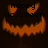 Animated orange pumpkin face with glowing eyes and jagged mouth, displaying 'Happy Halloween' text over dark background.