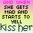 Animated text-based icon with repeating phrases 'AND WHEN SHE GETS MAD AND STARTS TO YELL' and 'kiss her' in varying colors on a gradient background.