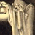 Animated contact sheet of a pixelated figure with flowing robes holding an object, accompanied by changing text across frames forming the phrase "SHE'S BUYING A STAIRWAY TO HEAVEN".