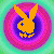 Pixelated bunny head with crossed ears and a small plus sign on its cheek, set against concentric circular color gradients in varying hues.