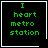 Four identical black square with white borders display green pixelated text reading "I heart metro station" with a small white heart symbol in the bottom-right corner of the rightmost