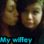 Two pixelated faces with brown hair and closed eyes appear side-by-side against a dark background, with blue text reading 'My wifey' at the bottom.