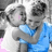 Pixelated grayscale image of two people embracing, one in blue clothing; adjacent black with white pixel text 'babe. thats. us.'
