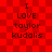 Red checkered background with four identical text blocks reading "I LOVE taylor kudalis" in dark red pixelated font.