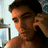 Pixelated image of a person holding a phone to their ear, with text elements 'SEXY', 'BABE', and 'BOI TOY SEAN' on light blue background.