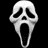 A white ghostly mask with black eye and mouth openings appears on a black background, accompanied by orange pixelated text reading "This is what I look like in the morning."
