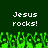 Green background with white pixelated text "Jesus rocks!" repeated twice, green pixelated grass-like shapes at the bottom.