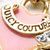A circular pink and gold icon with a decorative border, featuring text that changes from 'COUNT' to 'all you need is juicy'.