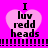 A pink heart-shaped icon with black text reading "I luv redd heads" on a bright purple background, featuring pixelated animation changes in the heart's outline and border.