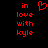 Red pixelated text 'in love with kyle' on black background, heart symbol above 'in', static image.