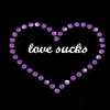 A heart-shaped icon made of purple gem-like dots with white cursive text reading 'love sucks' on a black background.