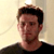 Static 50x50 pixel icon showing a person with dark hair and light skin wearing a black shirt against a pale background.