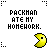 Pixelated yellow Pac-Man character with a black mouth and eye, positioned below text reading "PACKMAN ATE MY HOMEWORK." in blocky pixel font.