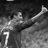 Pixelated grayscale image of a soccer player in mid-action with the number 7 on his jersey, alongside text reading "Cristiano" and "Cristiano Ronaldo".