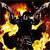 A static pixelated image shows a dark central shape surrounded by bright yellow and orange flame-like patterns against a dark background.