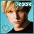 Pixelated portrait of a person with light brown hair and dark clothing against a blue gradient background, featuring partial text 'e55e' in the upper right.