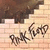 Pixelated image with brown and beige tones showing partial text 'Ry' and 'Grip' on a light background.