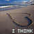 A 2x2 contact sheet of four animated frames showing a heart drawn in sand on a beach with text changing across the sequence.