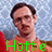 Pixelated image of a person with short dark hair wearing an orange shirt against a light blue background, with green text reading 'Hottie' at the bottom.