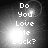 Pixelated text "Do You Love Me Back?" appears in four quadrants with varying brightness and glow effects on a dark background.