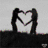 Animated icon shows two silhouetted figures forming a heart shape with their arms, transitioning to a rainbow-colored heart gesture with a rainbow arc.