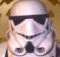 Six show a white armored figure with black visor and chest details against a brown patterned background, displaying sequential eye movements