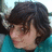Pixelated image of a person with dark hair in a teal shirt, accompanied by pixelated text reading "see this girl..." and "well shes my bff and i love her <333".