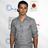 A pixelated image of a person in a gray V-neck shirt standing against a light background with faint blue and red shapes, next to green text on black reading "what? i can fly AND hoot lasers".