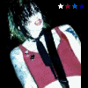 A person with dark hair and tattoos wears a red sleeveless top and black tie, shown in four with changing star colors above