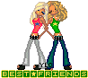 Two blonde women in pink and green shirts embrace, standing side-by-side with arms crossed over each other's backs.