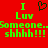 Red background with green pixelated text reading "I Luv Someone. Someone. shhhh!!!" and a black heart symbol above the text.