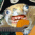 Pixelated cartoon character with wide eyes and open mouth holding orange object, repeated in with text overlays