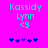 Pixelated text and symbols on a bright pink background with cyan and blue elements.