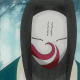 A character with long black hair and a white mask removes the mask to reveal their face, set against a blurred blue background.