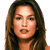 A static pixelated image of a person with long brown hair, light skin tone, and a neutral expression against a white background.