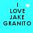 Pixelated text 'I LOVE JAKE GRANITO' on cyan background with animated white heart and starburst symbols.