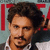A person with curly brown hair and a mustache wears a white shirt under a dark jacket, positioned against a light blue background with red text elements.