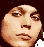 Pixelated static image of a human face with exaggerated features on a dark background, appearing as an AOL Instant Messenger buddy icon.
