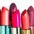 Four lipstick tubes with varying shades of pink and red displayed against a white background.