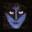 Pixelated icon with blue face, dark background, and subtle smile.