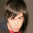 A pixelated image split into two sections: a person with dark hair on the left and a bright blue background with black text on the right.