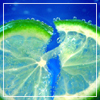 A static image of two lime slices with green rinds and translucent flesh against a blue background, framed by a white border.