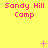 Yellow background with red text 'Sandy Hill Camp' repeated across three , featuring small pink and white pixelated symbols above the middle