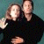 A 50x50 pixel animated buddy icon featuring two people in a close pose on the left and green text "Original Icons .com" on the right, displayed as a contact sheet with two frames.