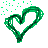 Green pixelated heart shape with scattered green square particles on gray background.