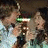 A pixelated image divided into four quadrants with two people embracing in the top-left and cyan text on dark green backgrounds.