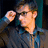 A pixelated image of a person adjusting glasses with yellow text reading "I'm a NERD And DAMN Proud of it" on black and gray backgrounds.