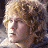 A 48x48 pixel buddy icon featuring a side-profile of a character with curly blonde hair and golden text reading "LORD OF THE RINGS" on the right, set against a dark brown background with light effects.