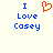 Blue text reading 'I Love Casey' with a red pixelated heart symbol replacing the word 'love' in the first view, transitioning to the same text without the heart in the second view.