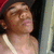 A person wearing a red cap and light-colored tank top appears in a of four with slight variations in head position and background elements